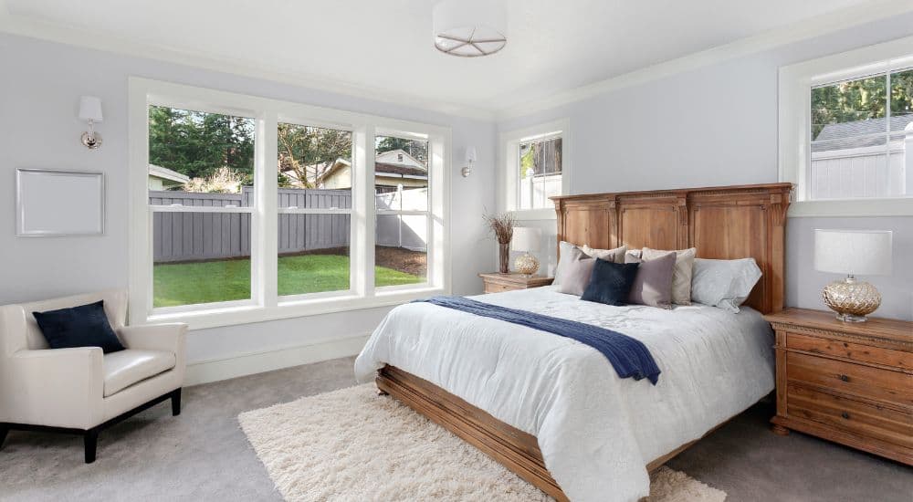 Bedroom with a timber headboard and soft furnishings