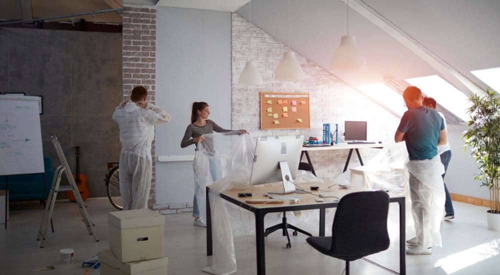 Office being renovated with furniture moved aside